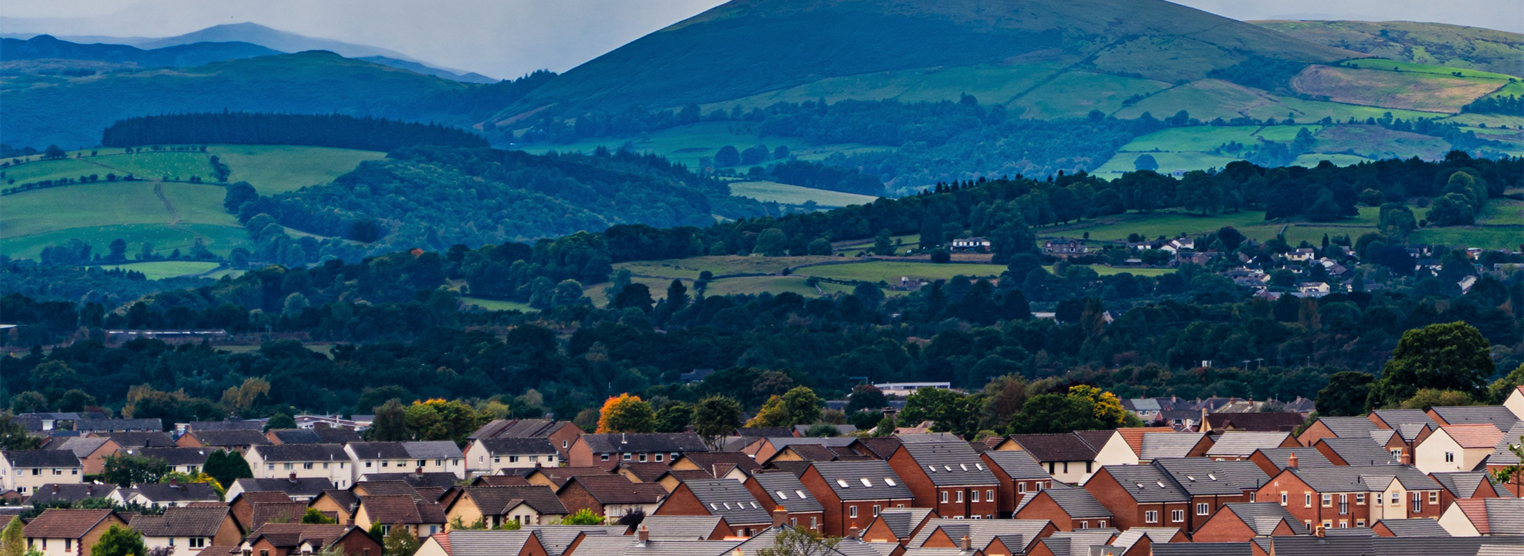 Cumbrian landscape showing a town in the foregound Cumbria landscape