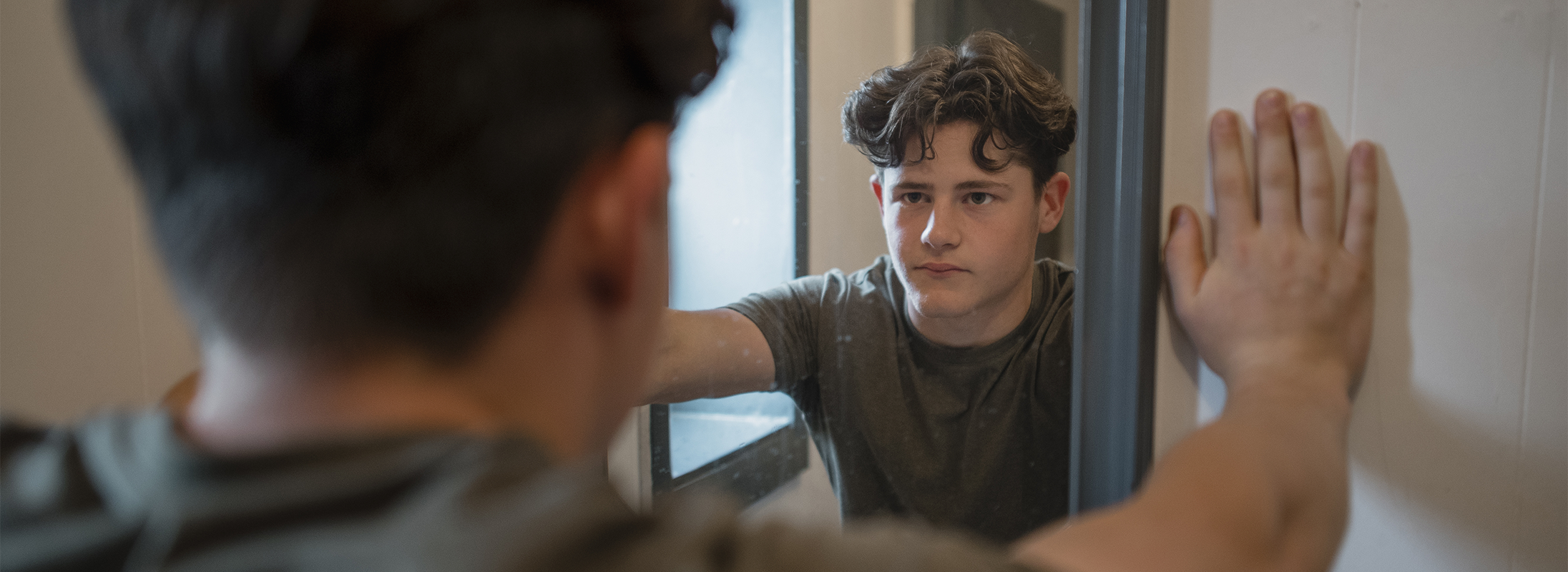 Teen looking in mirror Teen looking in mirror